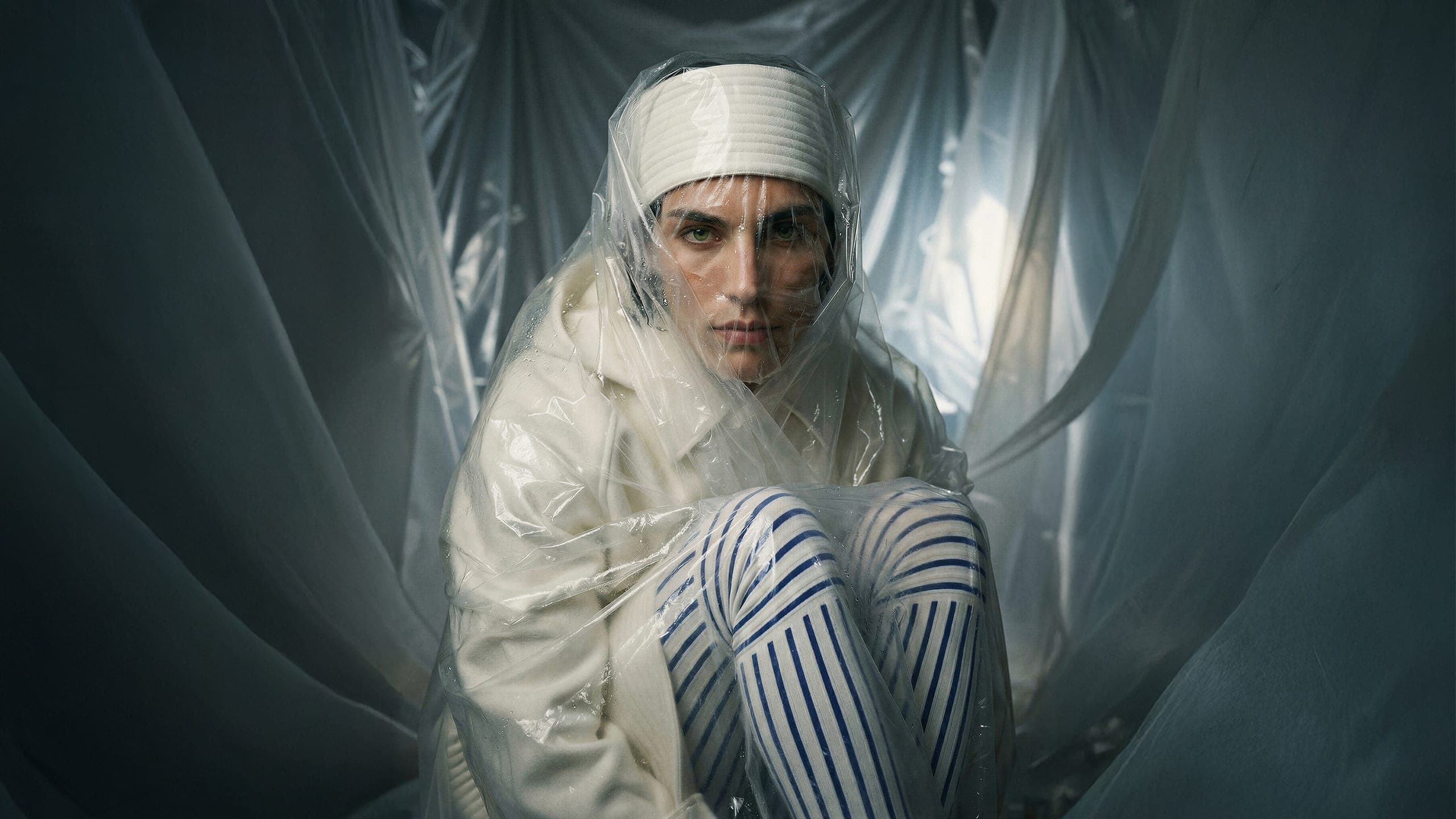 Model wrapped in translucent film — AI fashion image by editmode.ai
